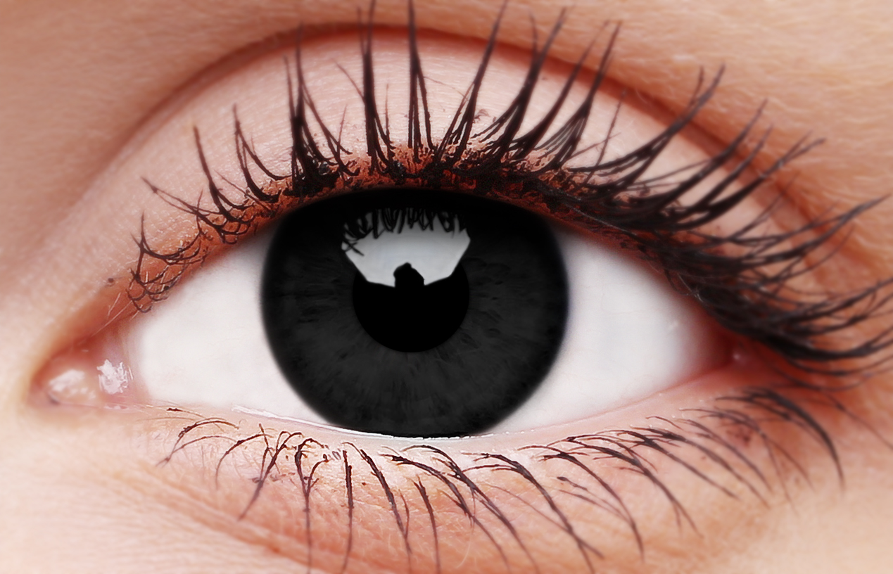 ColourVUE Blackout black contact lens on eye showing full black-out effect